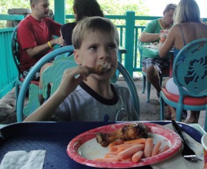 Kevin enjoying a food allergy-free meal at Flame Tree BBQ